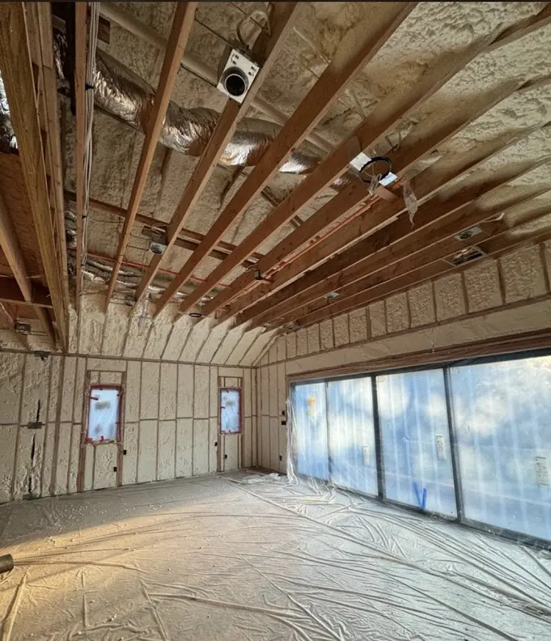 Interior walls and ceiling insulated with spray foam during new construction in Worcester